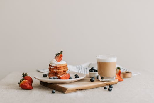 a stack of whole grain pancakes topped with fresh berries